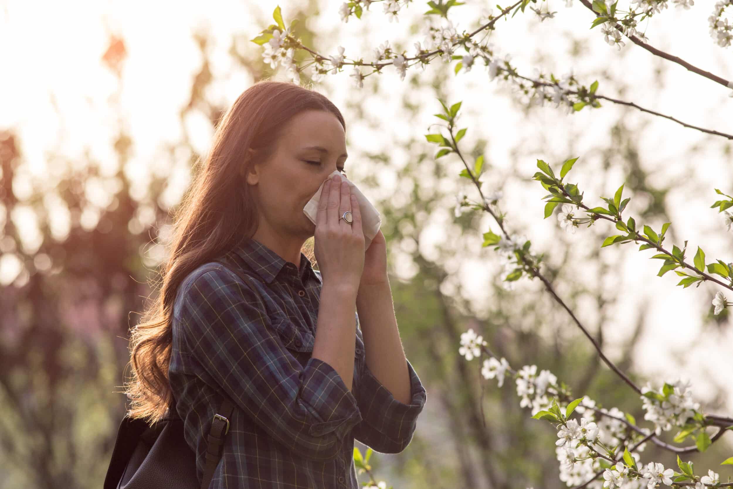 Woman using a tissue during allergy season